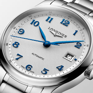 LONGINES 浪琴 MASTER 巨擘系列銀色麥粒紋藍鋼針自動機械腕錶 39mm L2.949.4.73.6 - 新萬國鐘錶